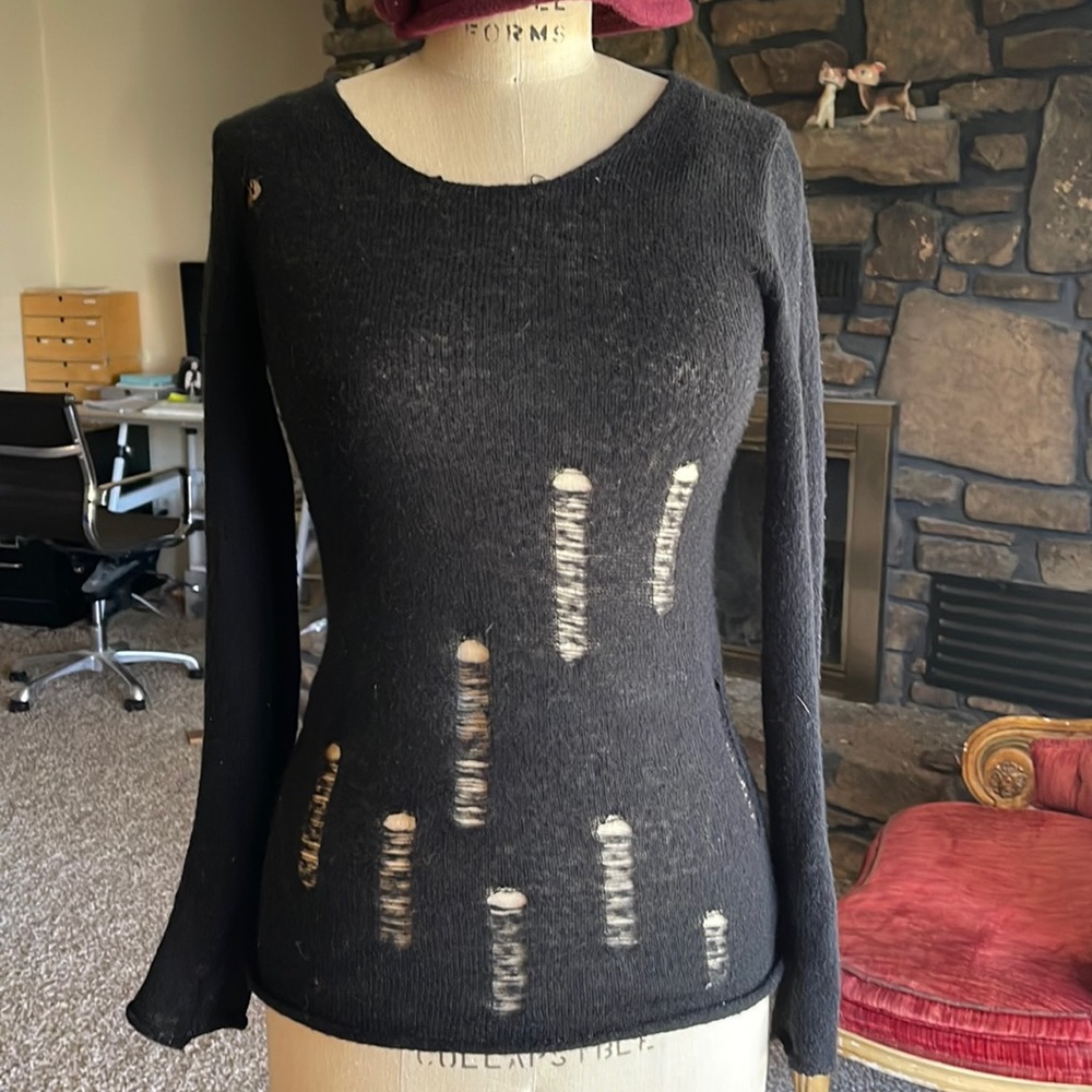 A black size S deconstruction sweater.